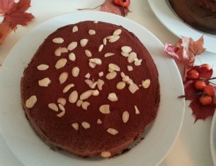 Kakao dusted chocolate cake with almonds